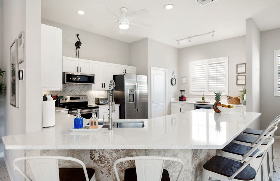 Spacious, fully equipped kitchen with room to gather and cook together