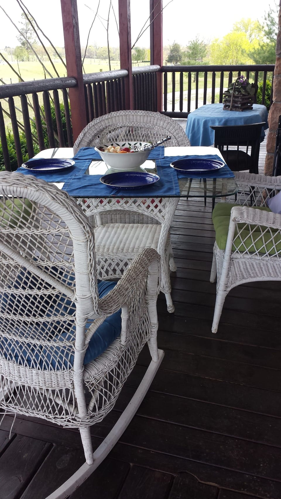 Deck has table and settings to enjoy dining outside and seating  for 20 