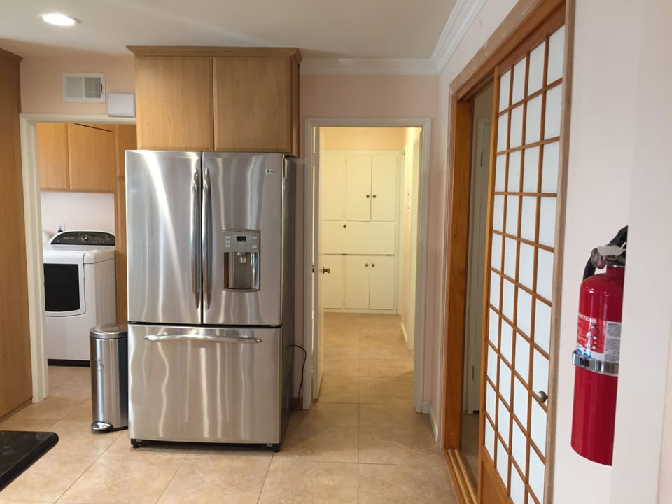 Hallway Cabinet: Towels/Bed Sheets/ Blankets. Laundry room next to Kitchen