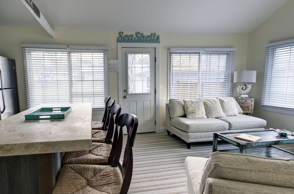 Living room, entrance and bar seating