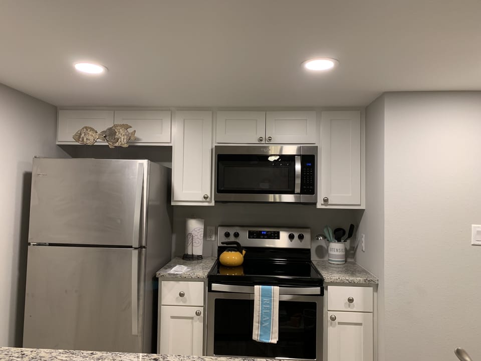 Fully stocked kitchen including brand stainless appliances. 