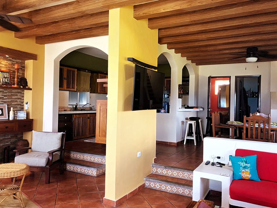 Spacious living room and oversized sectional couch with Caribbean views