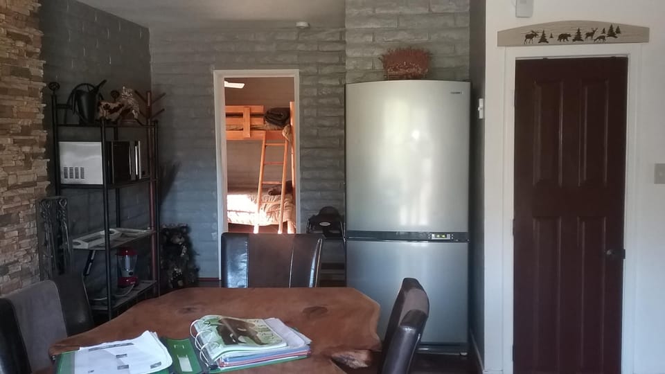 Fridge can fit pizza boxes. Large Pantry. Microwave and portable dishwasher.