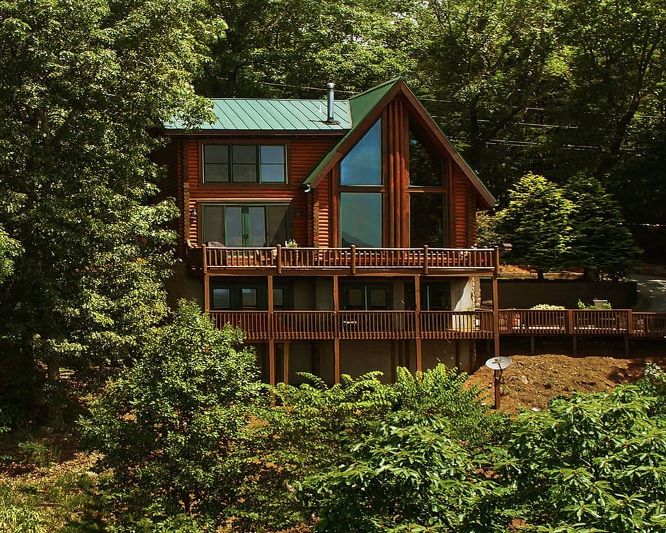 Aerial view of the back of the home overlooking the lake.