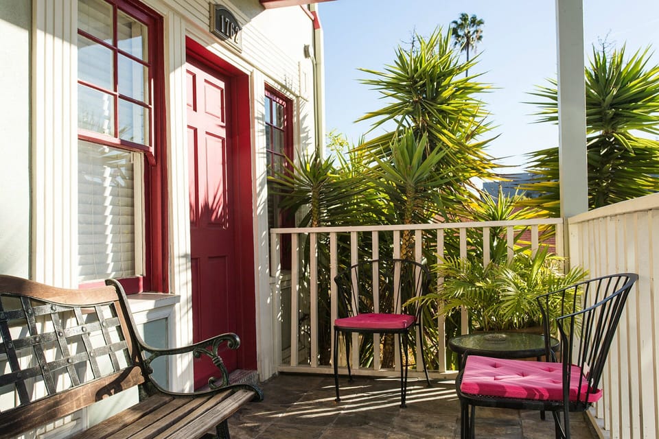 Entrance into apartment with porch + seating
