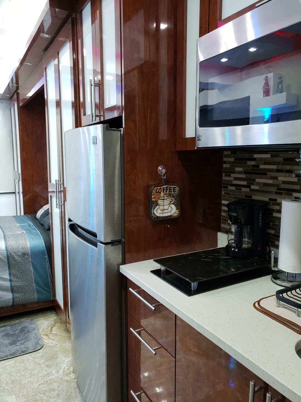 Full 24 inch refrigerator, 2 burner cooktop, and full microwave