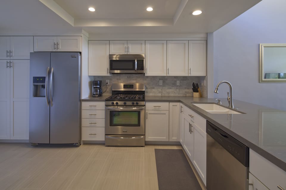 Completely updated kitchen is fully equipped and includes gas range