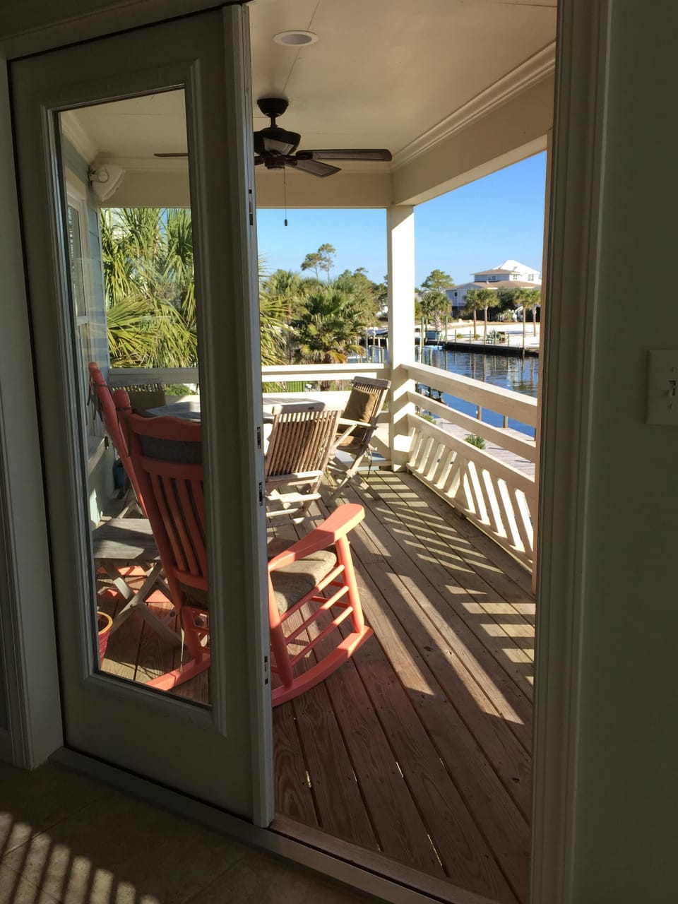 French doors leading to the deck overlooks the water