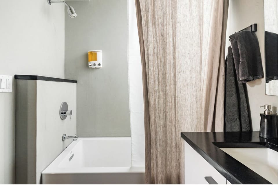 Bathroom with tub and shower