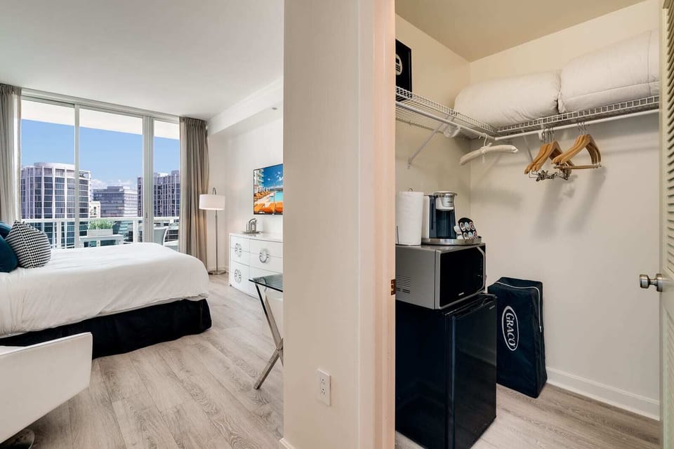 Tucked in the large walk-in closet is a mini-fridge & microwave