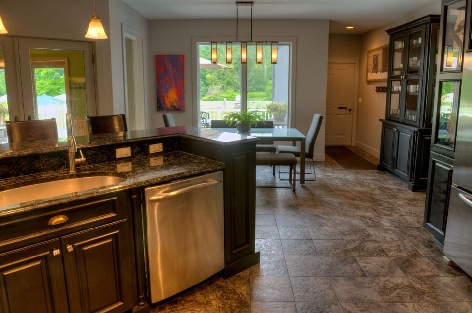 European Style gathering kitchen has separate seating with Italian glass dining.