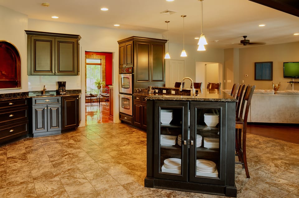 Gourmet kitchen and dining with open area to greatroom, sunroom and dining room