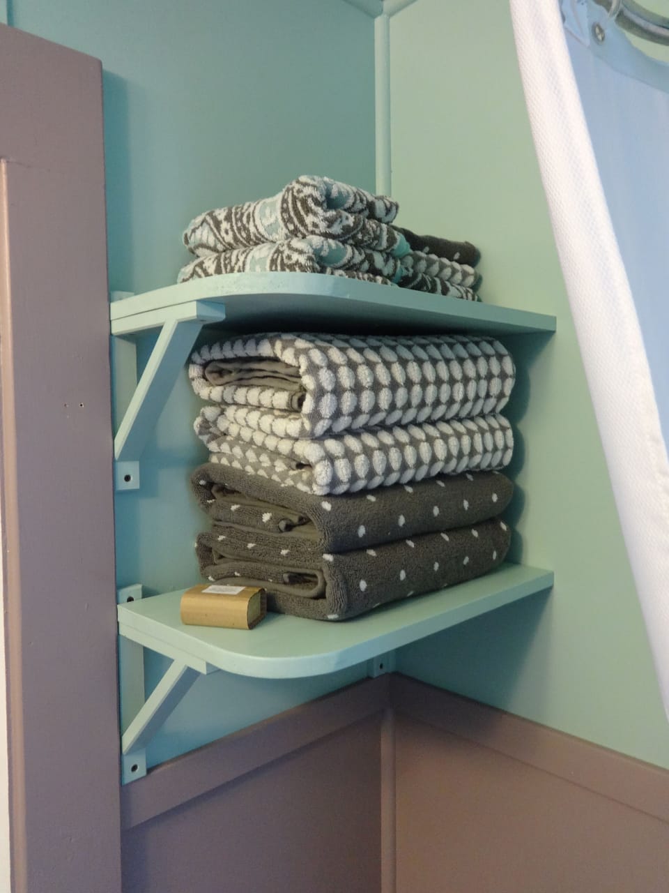We provide a pile of fluffy towels, shampoo, and conditioner