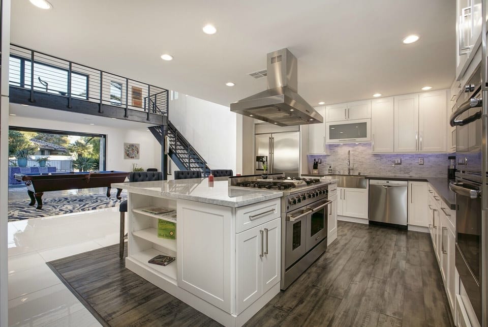 GOURMET KITCHEN WITH VIEW OF POOL
