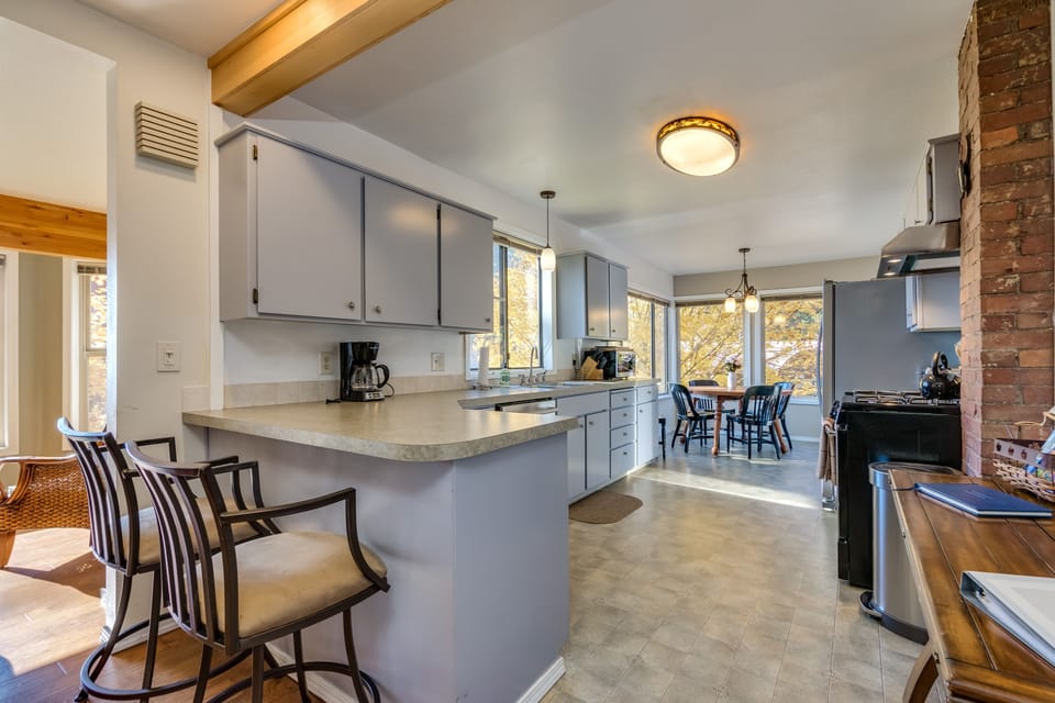 Kitchen with adjoining dining area all with views of the lake