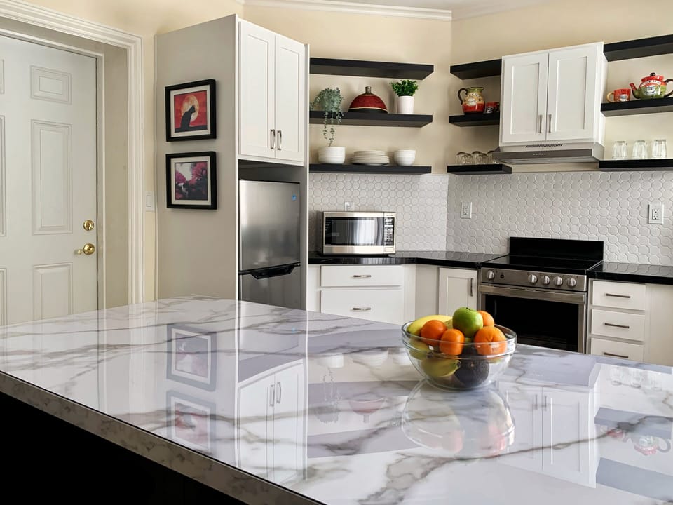 Kitchen island with Marble veneered top 