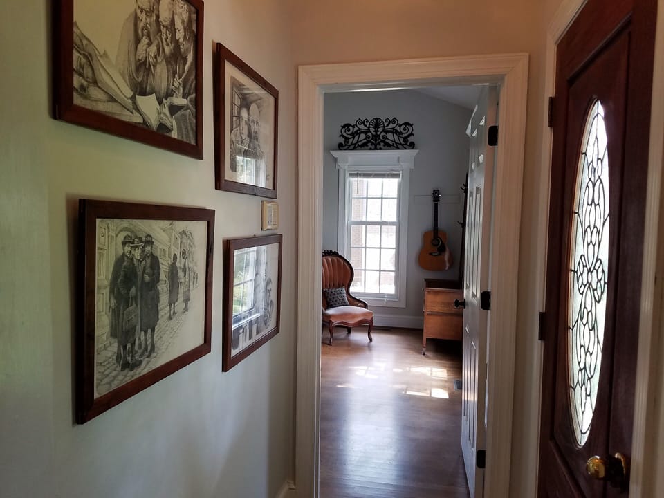 Hallway leading to main level primary bedroom