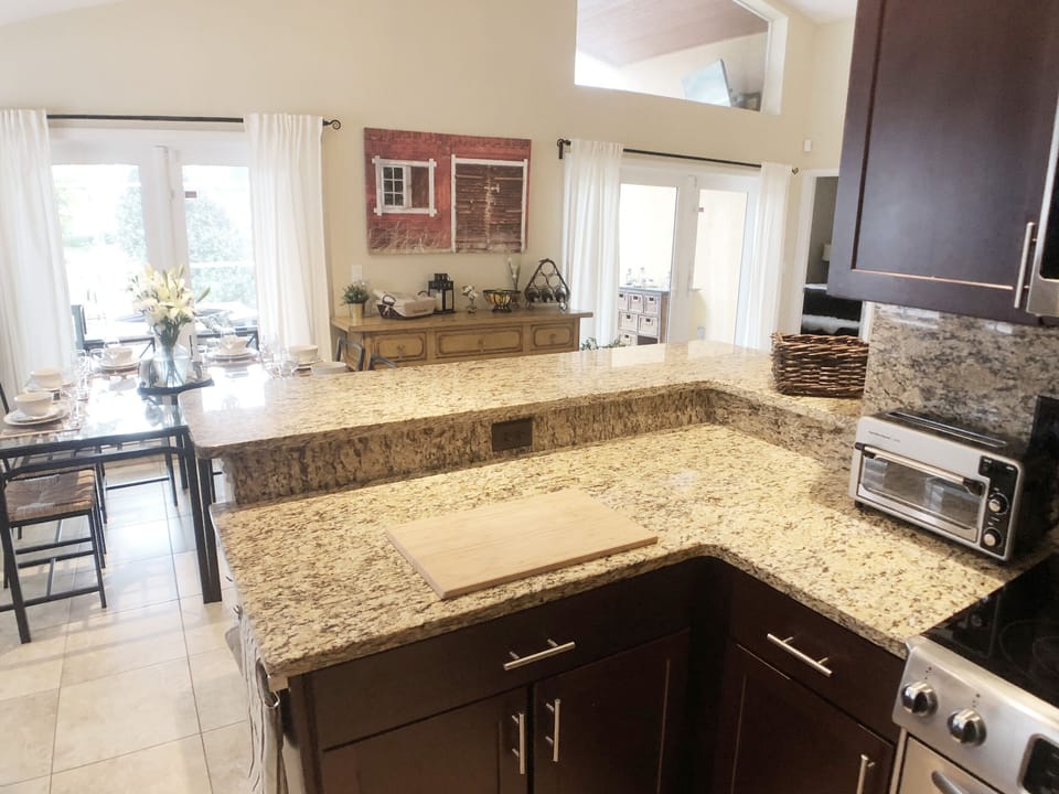 Kitchen with granite breakfast bar.