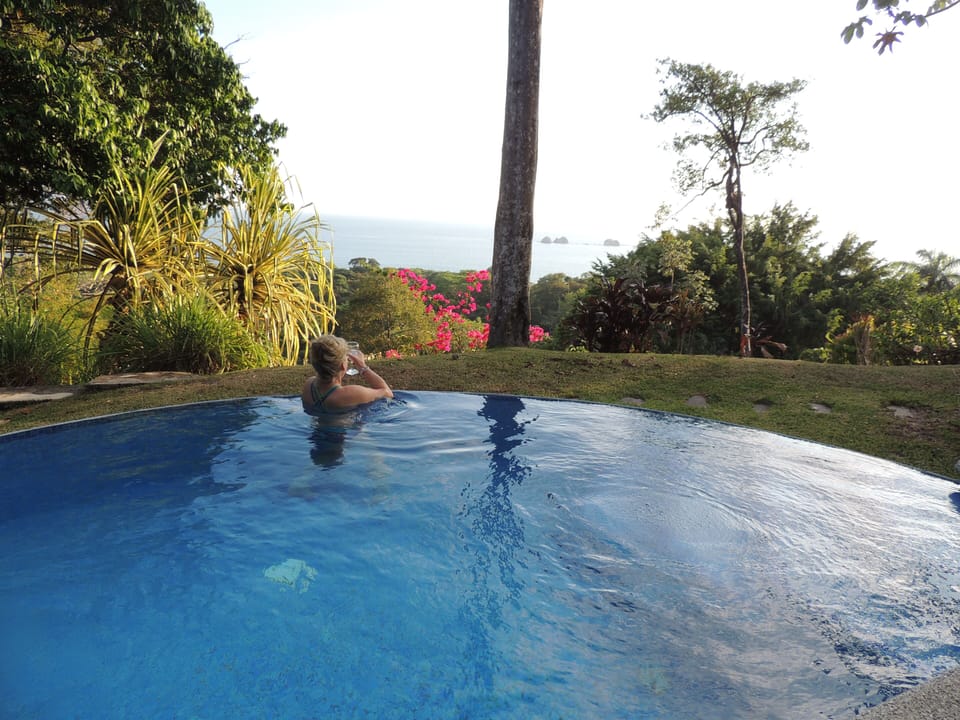 Relax in the infinity pool with your favorite beverage.