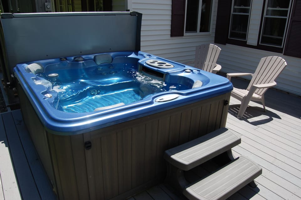 hot tub on back deck, great after a long day of activity