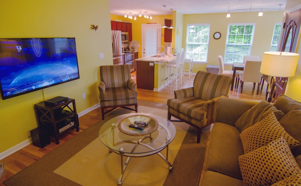 Living room view into Dining room and Kitchen.