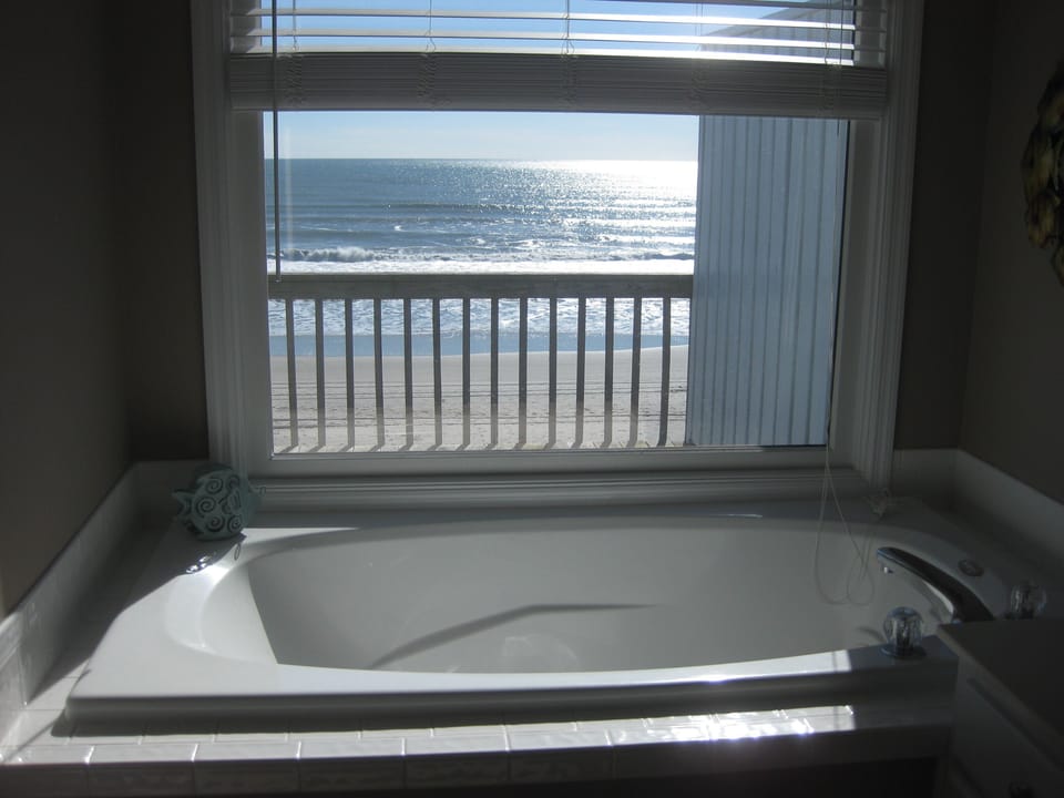 jacuzzi overlooking ocean in master bathroom