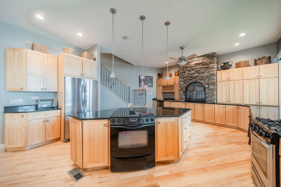 Kitchen island with Jenn Air electric range and oven.