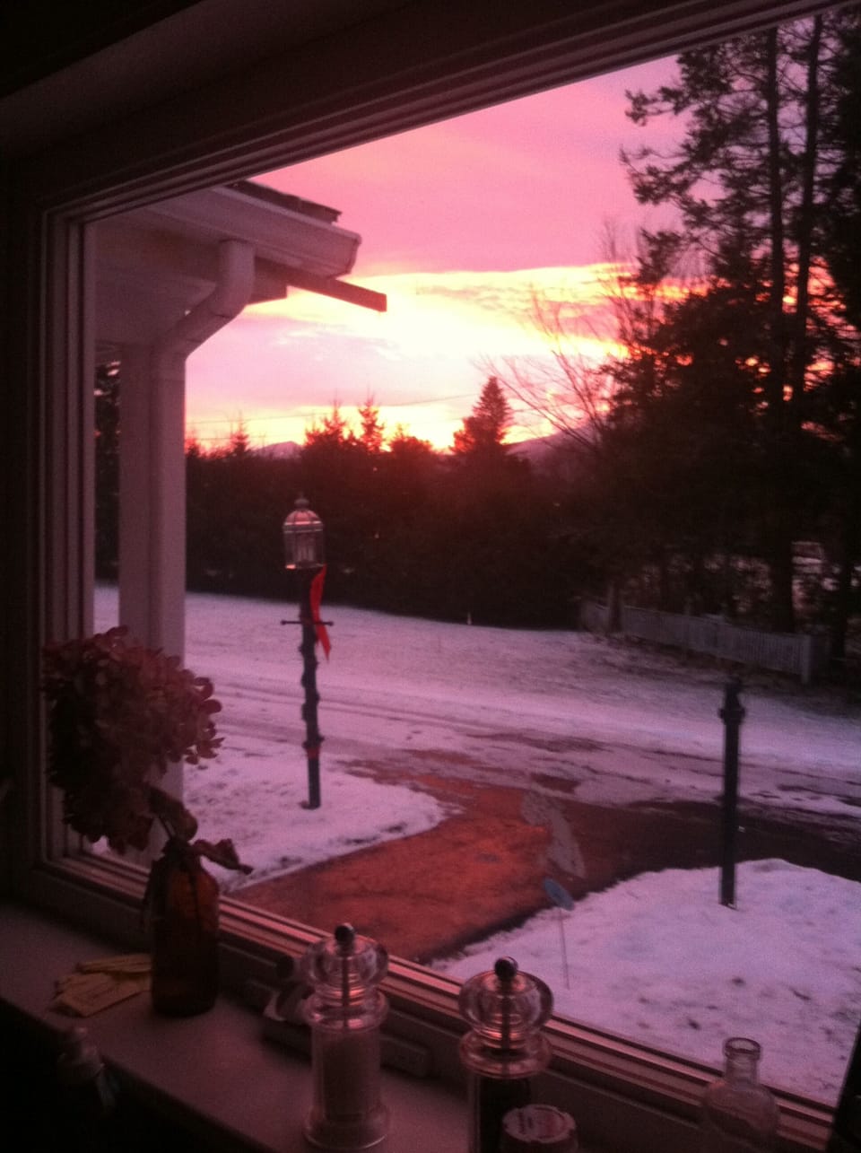 morning sun rising out of kitchen window  