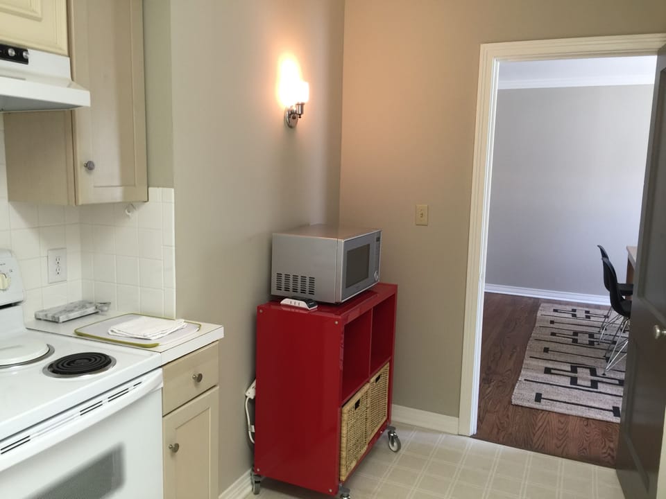 Fully stocked appliances in kitchen. Pots, pans, dishes, seasonings, etc.