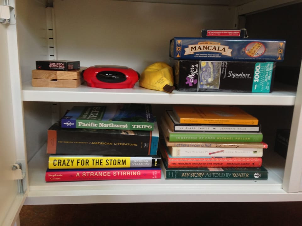 Games, books and puzzles in the cabinet for guests
