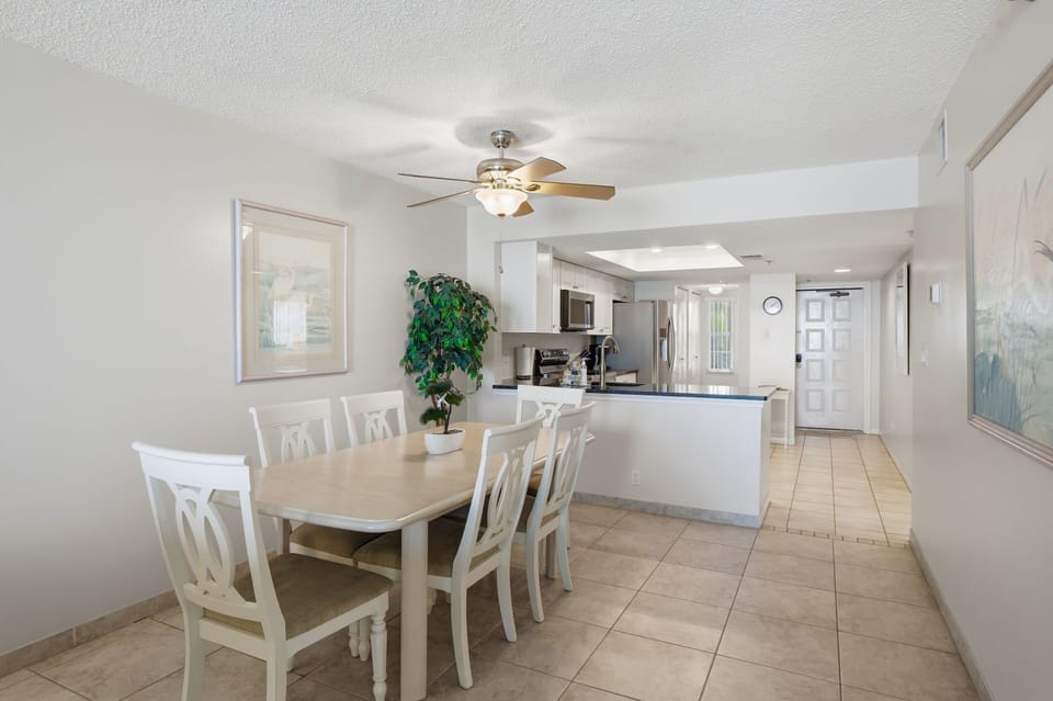 View of dining area that seats 6 and kitchen