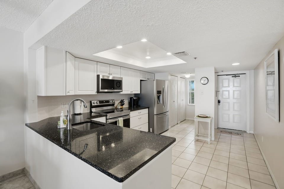 Large modern kitchen with direct access to laundry area and front door access