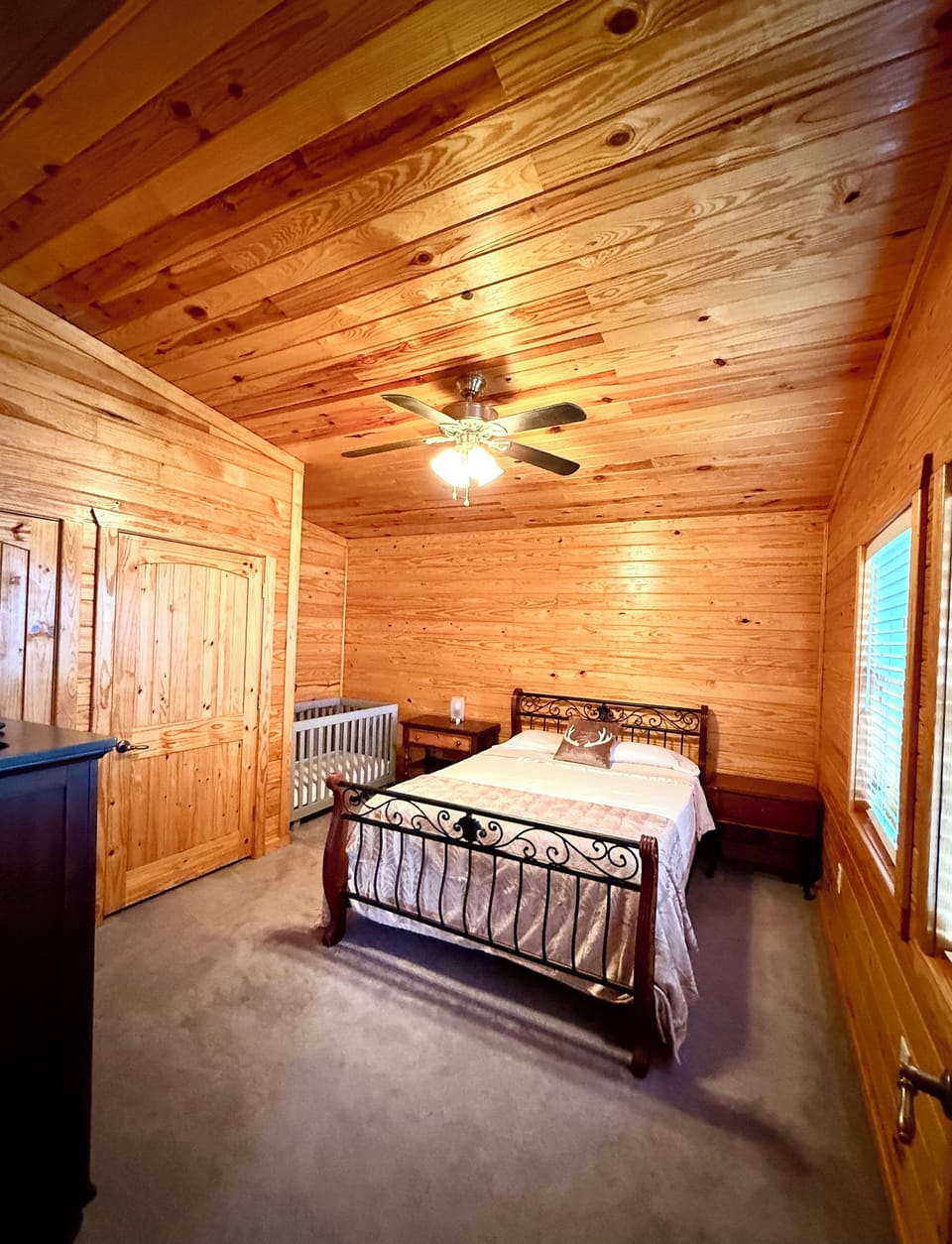 Bedroom #3 on 2nd floor.  Queen bed, full size crib, dresser, 32” TV