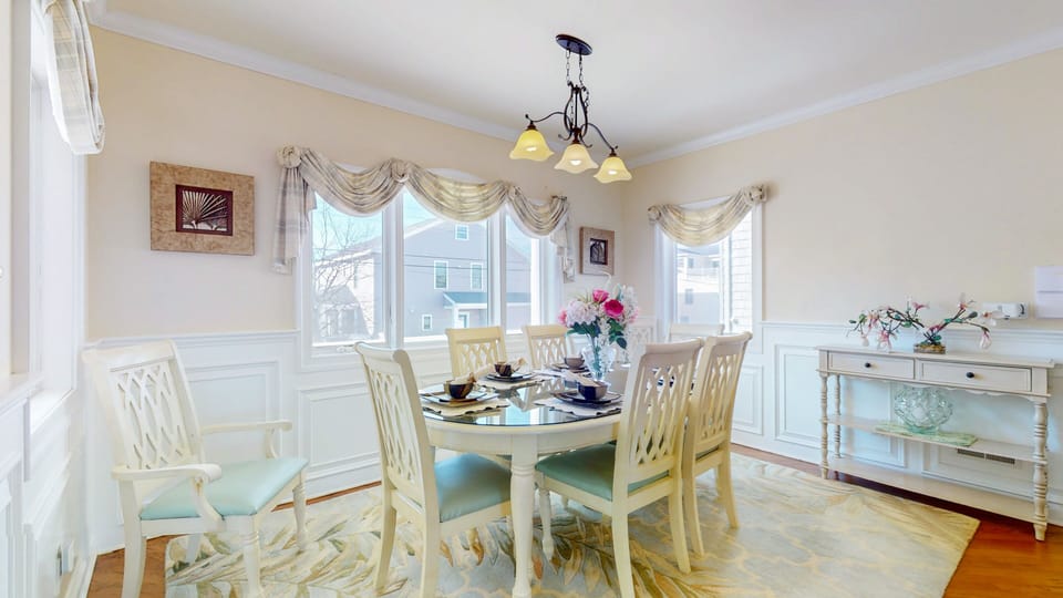Dining table with seating for 8 is directly adjacent to the granite bar.
