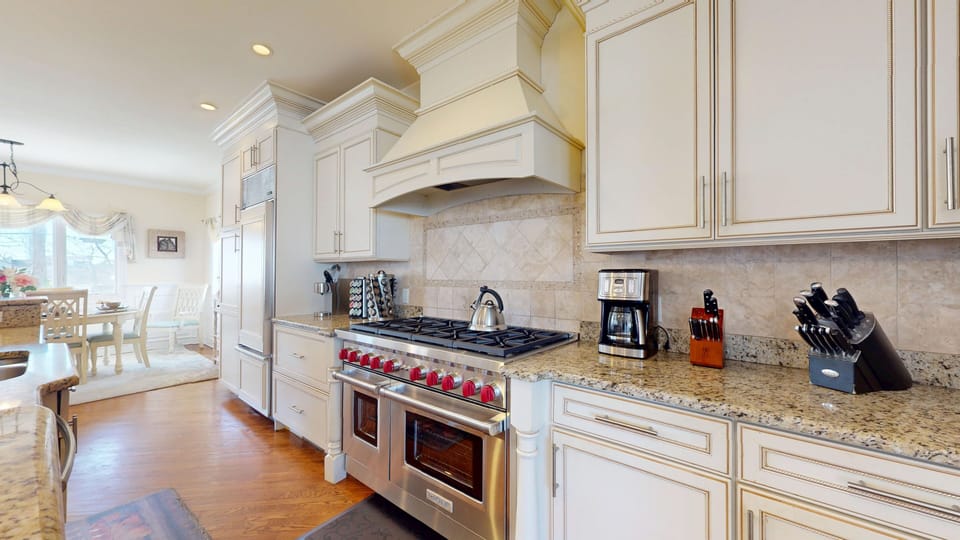 Gourmet Kitchen w/ 2 Sub Zero Refrigerators, 2 Dishwashers and 8 burner stove.