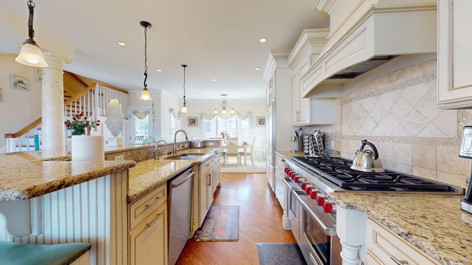 Gourmet Kitchen w/ 2 Sub Zero Refrigerators, 2 Dishwashers and 8 burner stove.
