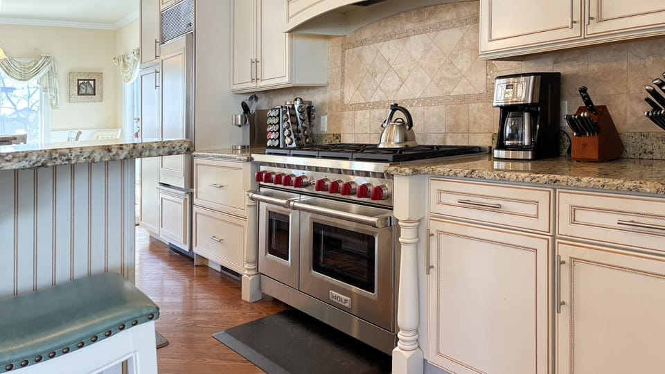 Gourmet Kitchen w/ 2 Sub Zero Refrigerators, 2 Dishwashers and 8 burner stove.