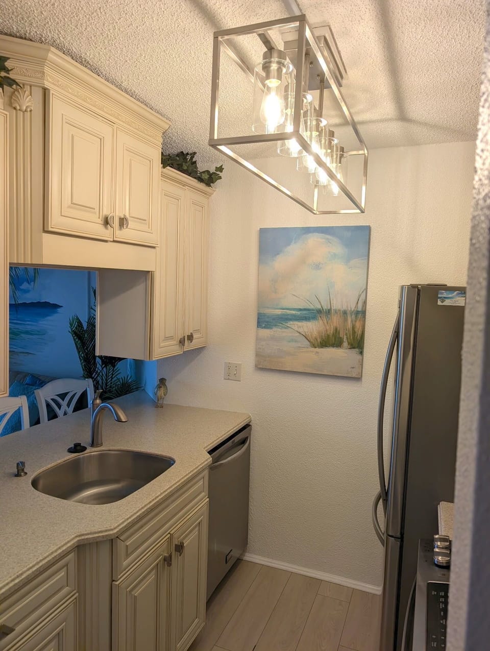Kitchen with stainless appliances, Keurig coffee maker and fiesta dishes