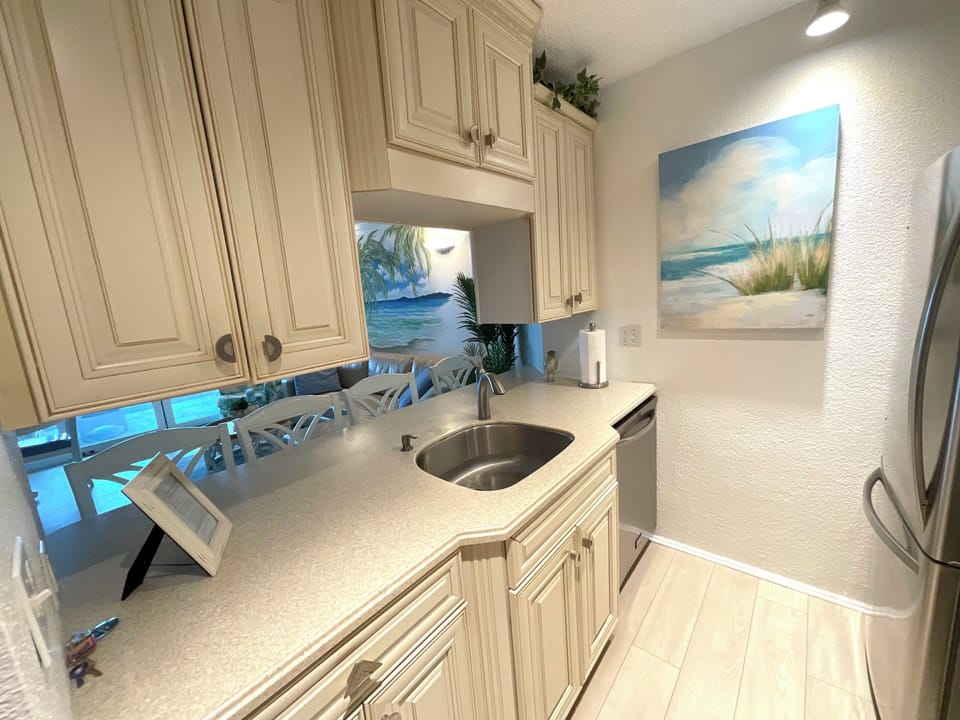 Kitchen fully stocked with cookware and dishes. Ocean Front view!