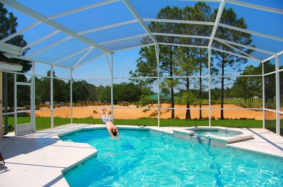 Owner diving in ( shows size of Pool )
