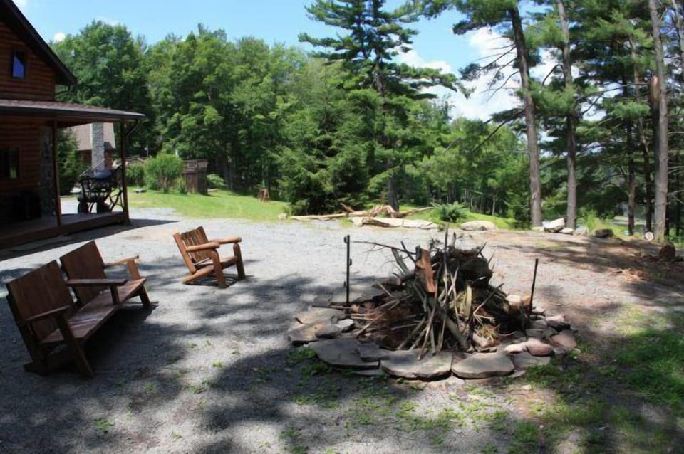 Outdoor fire pit next to private porch.