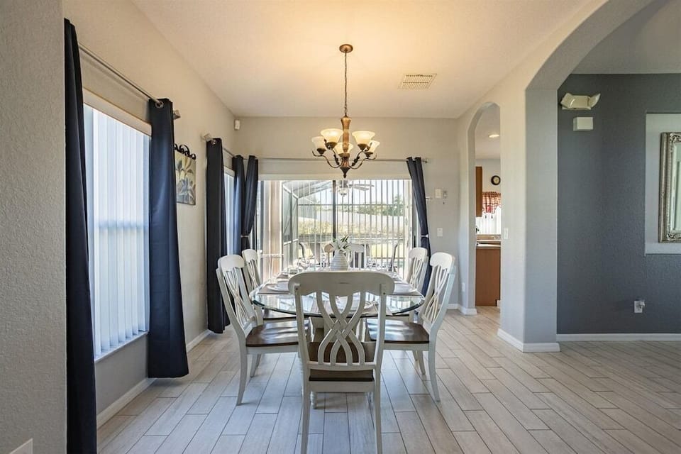 Bright dining area with seating for six, ideal for shared meals and conversations.