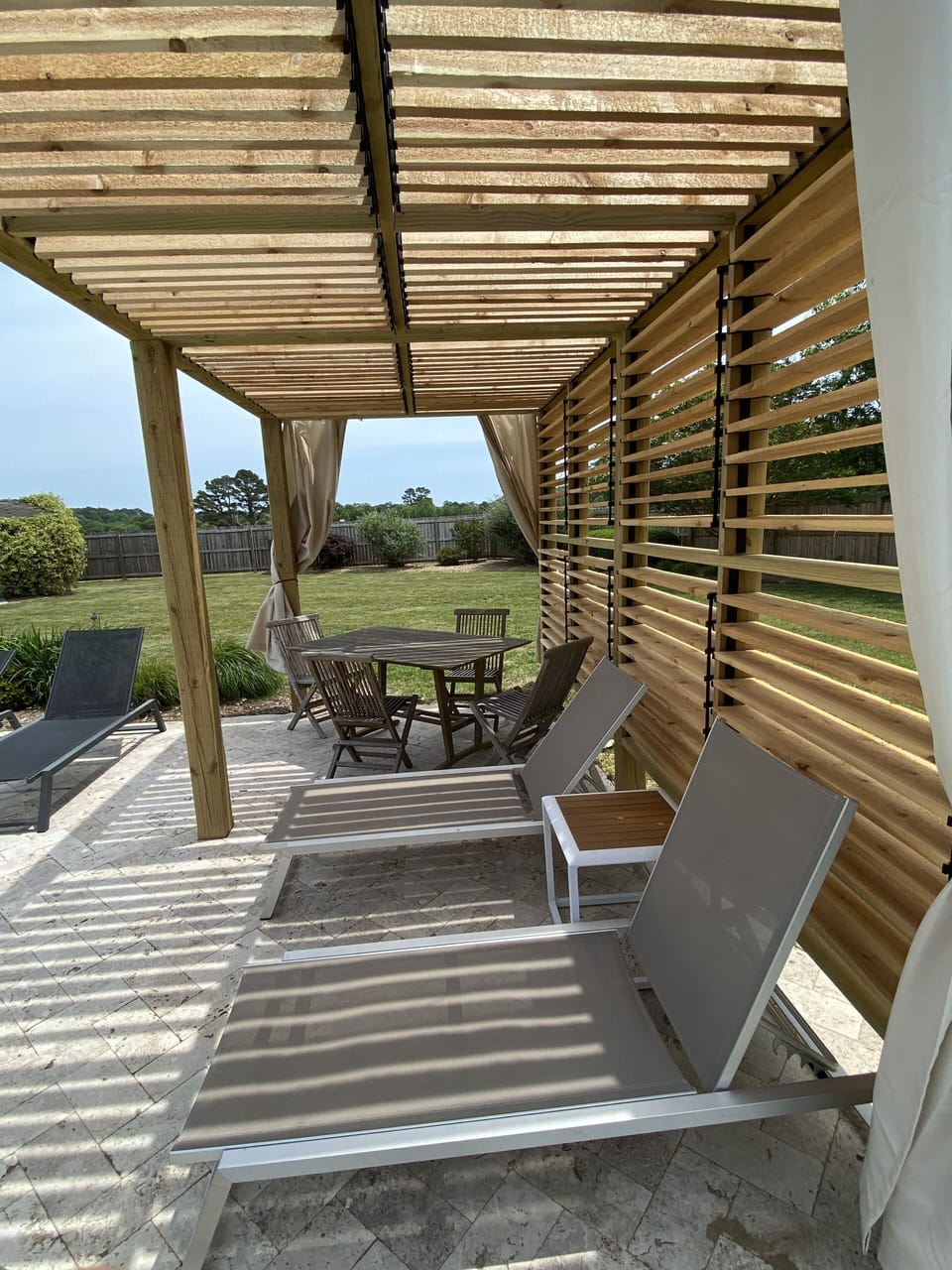 A new shuttered pergola offers shelter from the sun.  Built in 2021.