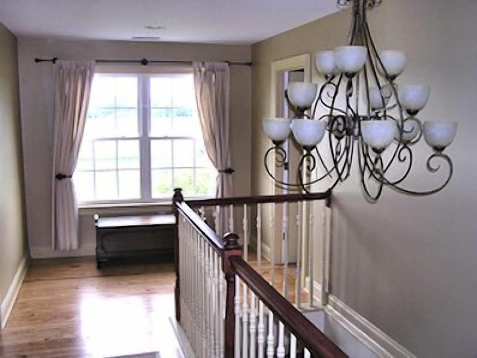 2nd-floor landing with its four bedrooms and two baths.