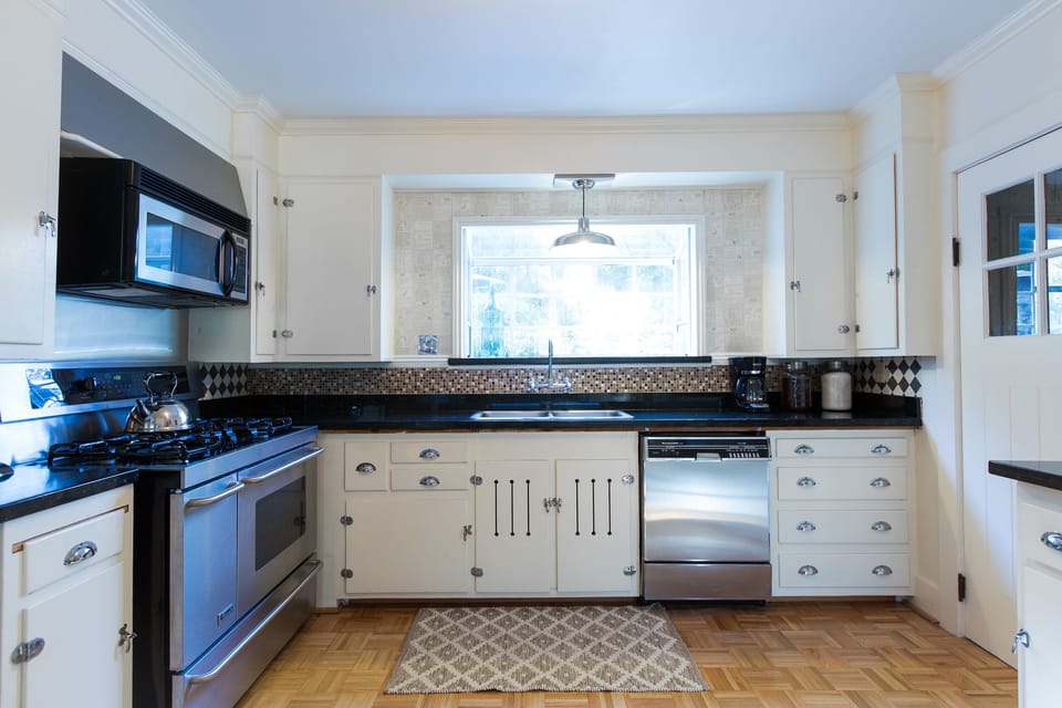 Chefs kitchen with a great view to the back patio!