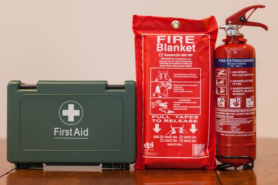 Fire extinguisher, fire blanket and first aid kit