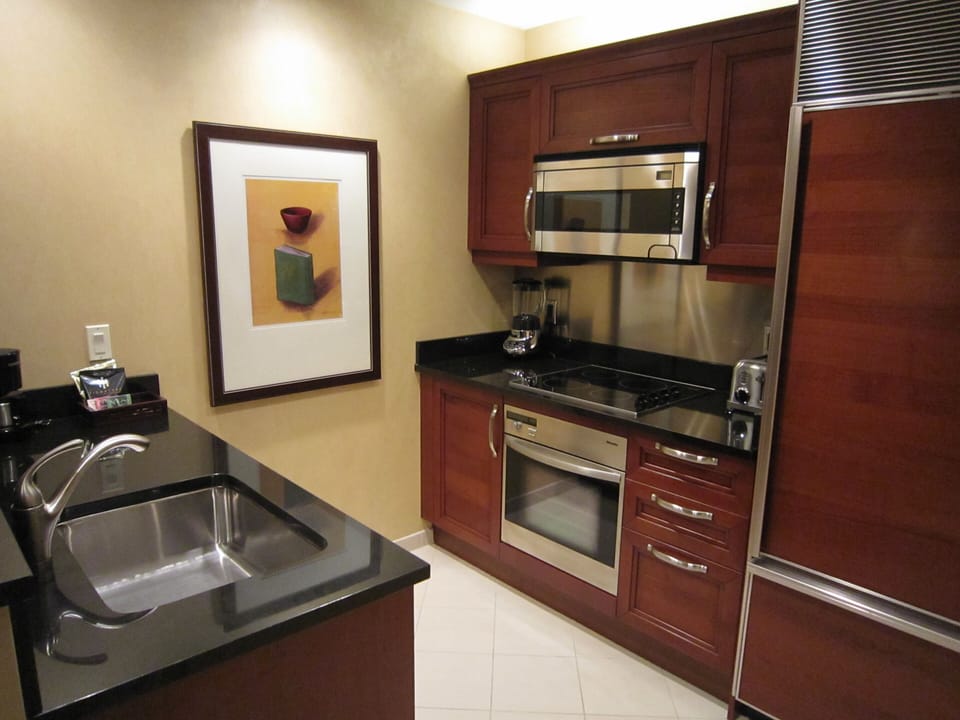 Full kitchen w/ stove, oven, refrigerator, dish washer, microwave, coffee maker