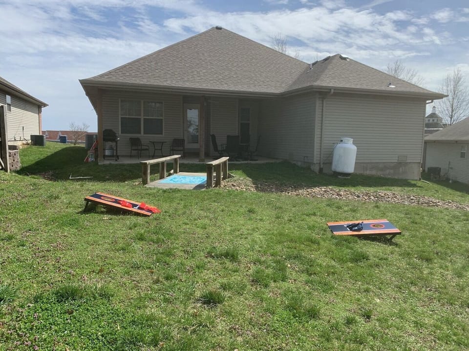 Back yard with BBQ, large back yard, outdoor games & seating area