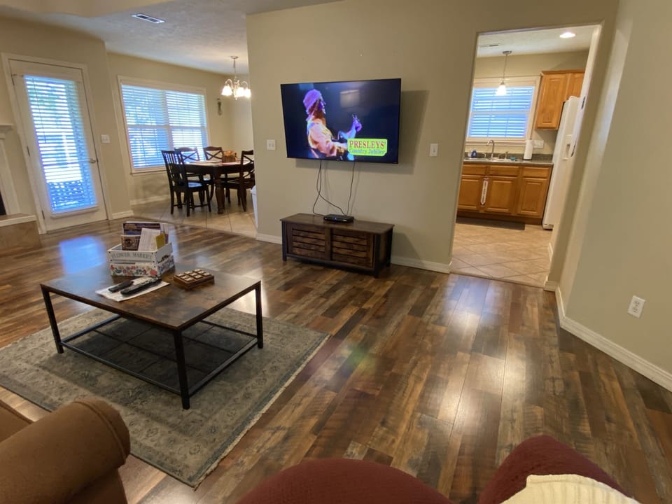 Family living room w/ hide a bed, smart HDTV incl. local cable channels, and propane gas log fireplace.