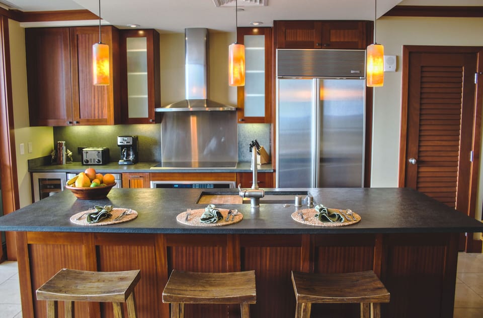 The kitchen features designer appliances to bring out the master chef in you!